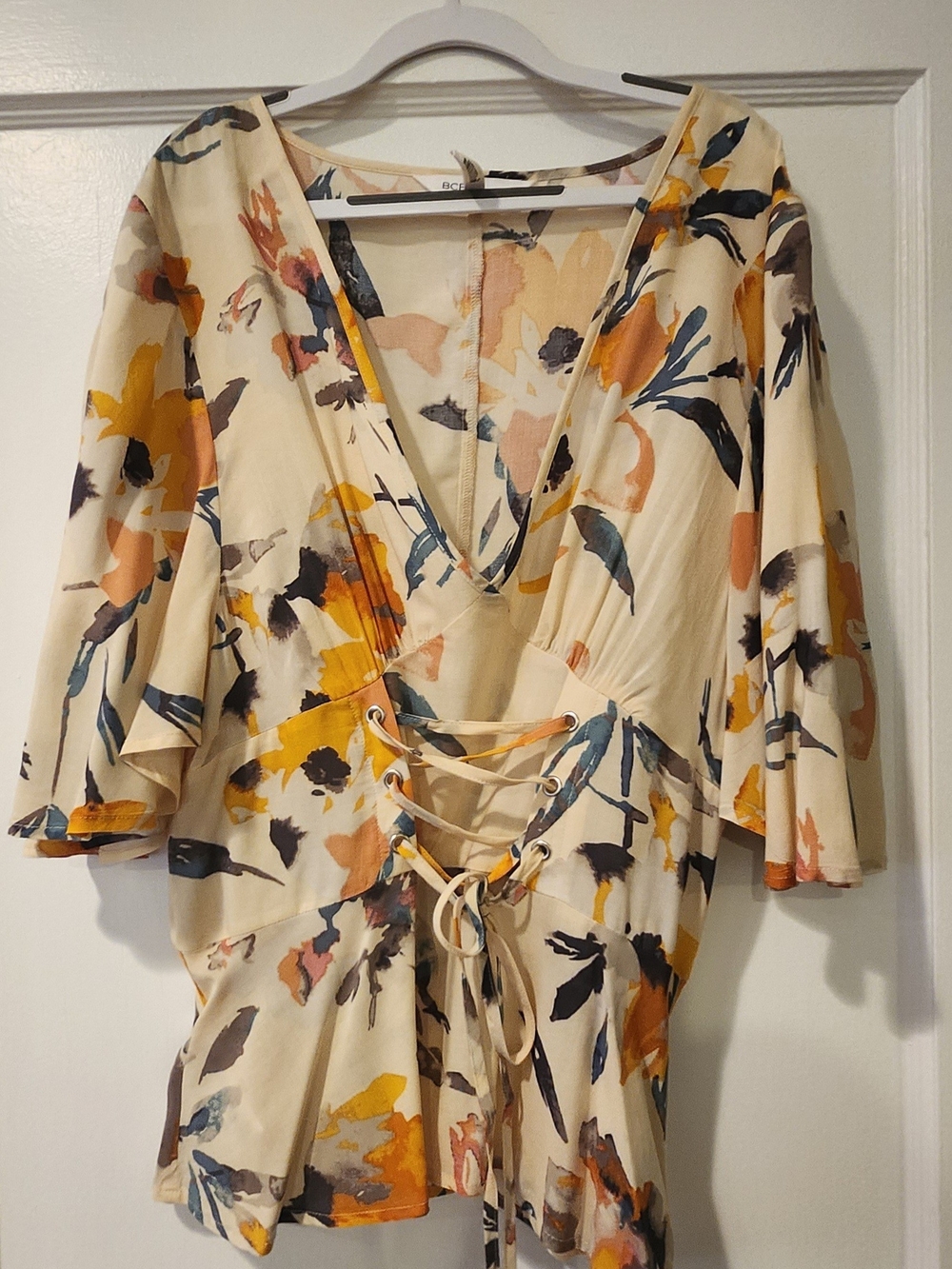 BCBGeneration Cream Floral Lace-Up V-Neck Blouse with Mustard and Navy